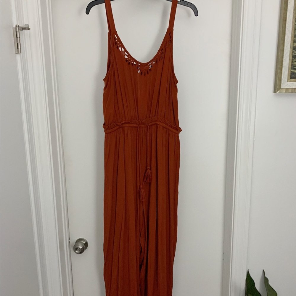 70s inspired burnt orange jumpsuit